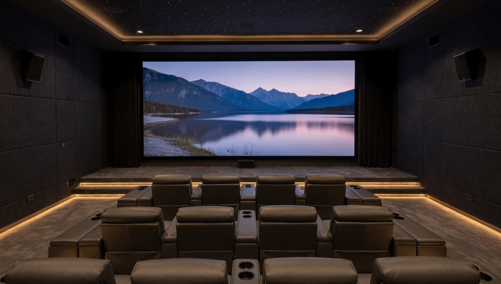 A dedicated home theater with a large LED wall in front of two rows of recliners